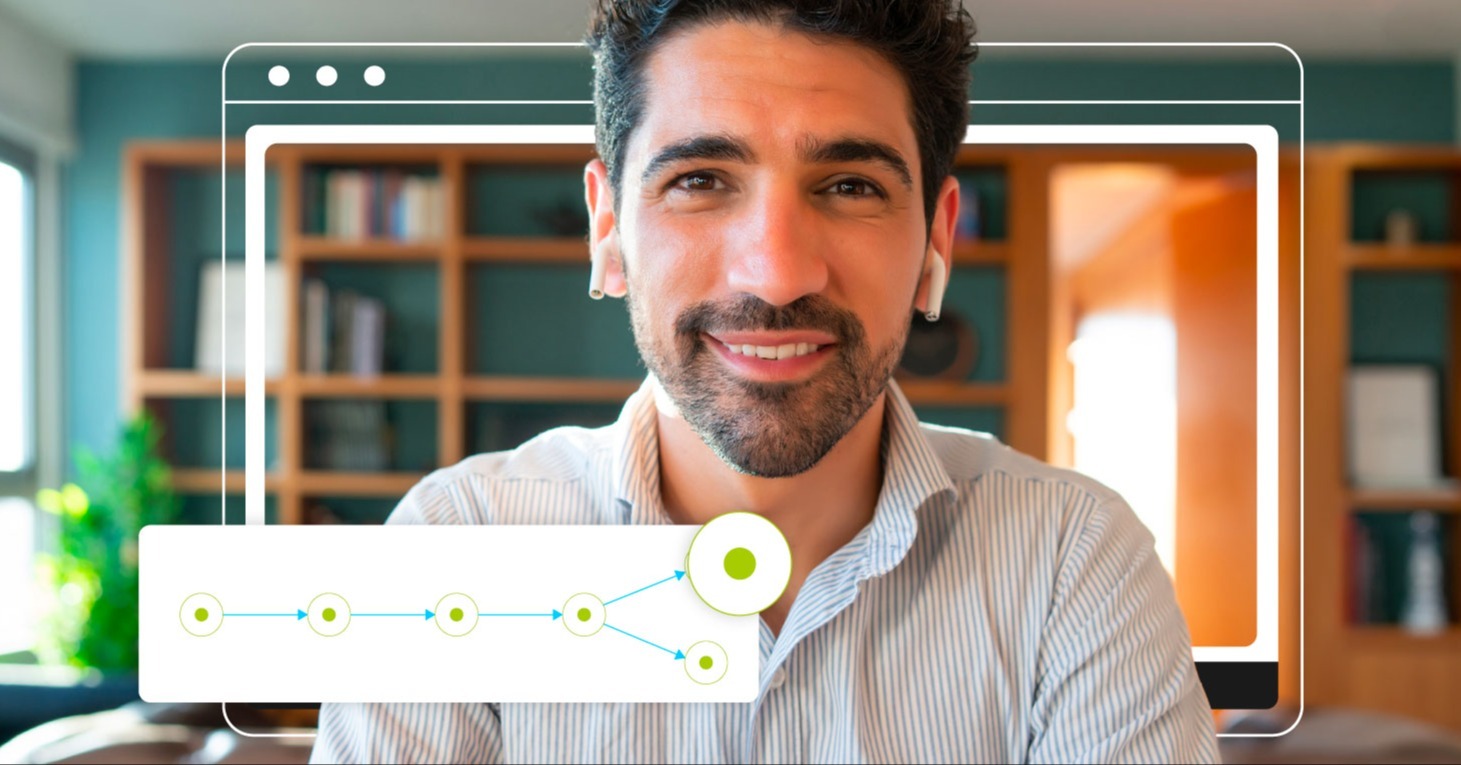 A male employee smiling while engaging with an adaptive learning program